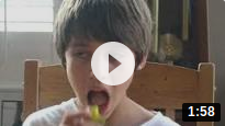 Boy eats a pickle